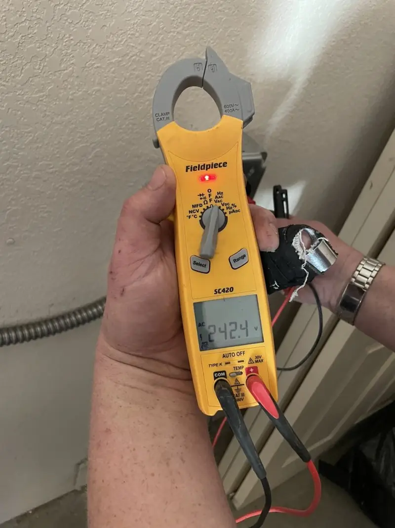Voltage testing with clamp meter during Recessed Lighting Installation in East Haddam